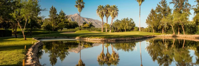 View of La Concha mountain over a lake in La Quinta Golf Course in Benahavis, Spain. frontline golf courses and golf lifestyle. Los Flamingos vs La Quinta