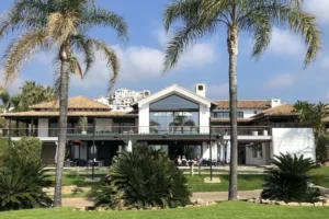 The clubhouse at Los Arqueros Golf Course. Los Arqueros luxury real estate for sale